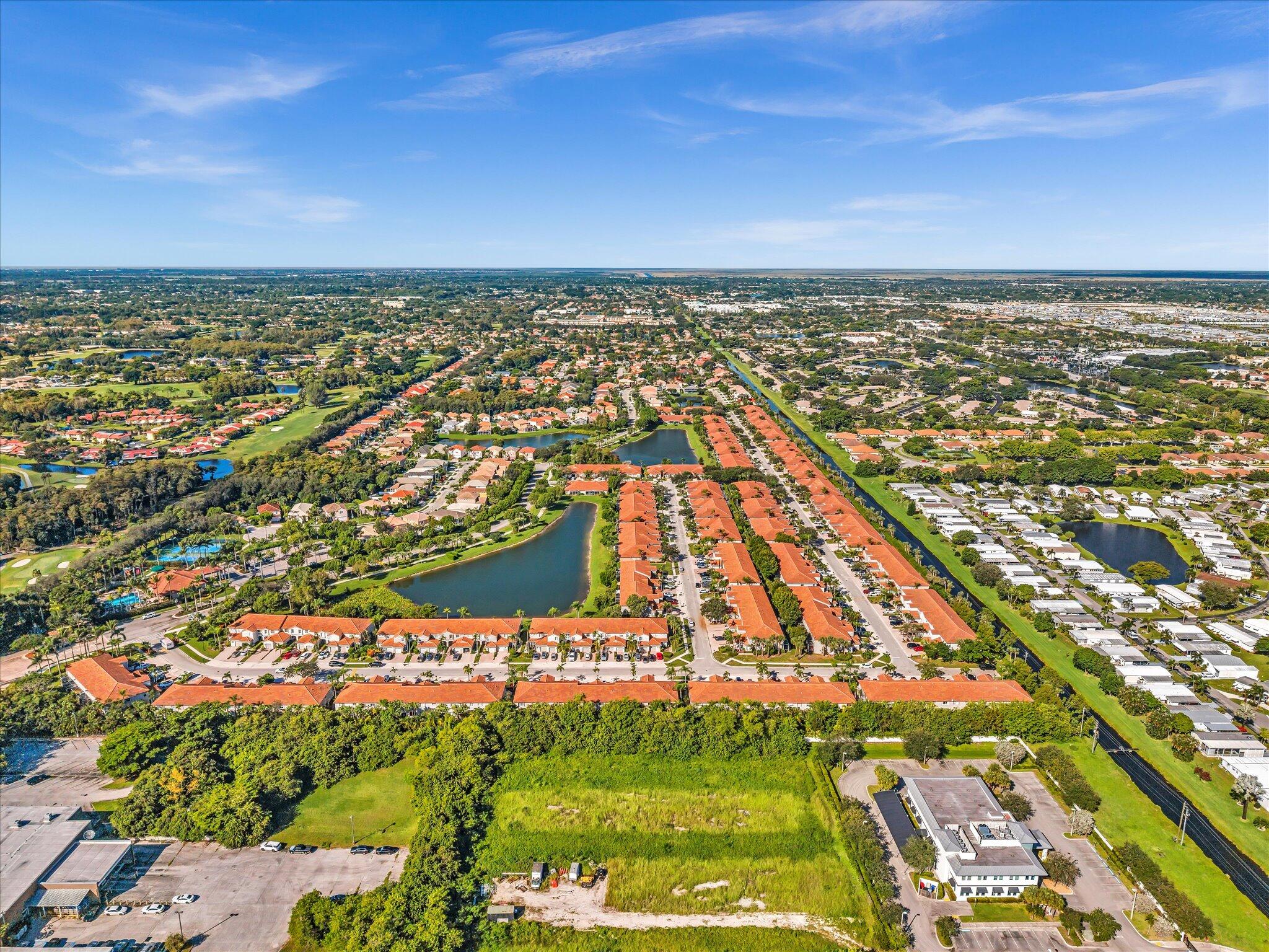 21018 Vía Eden, Unit 21018 Boca Raton, FL 33433 - Photo 59 of 63 an aerial view of residential building with an ocean