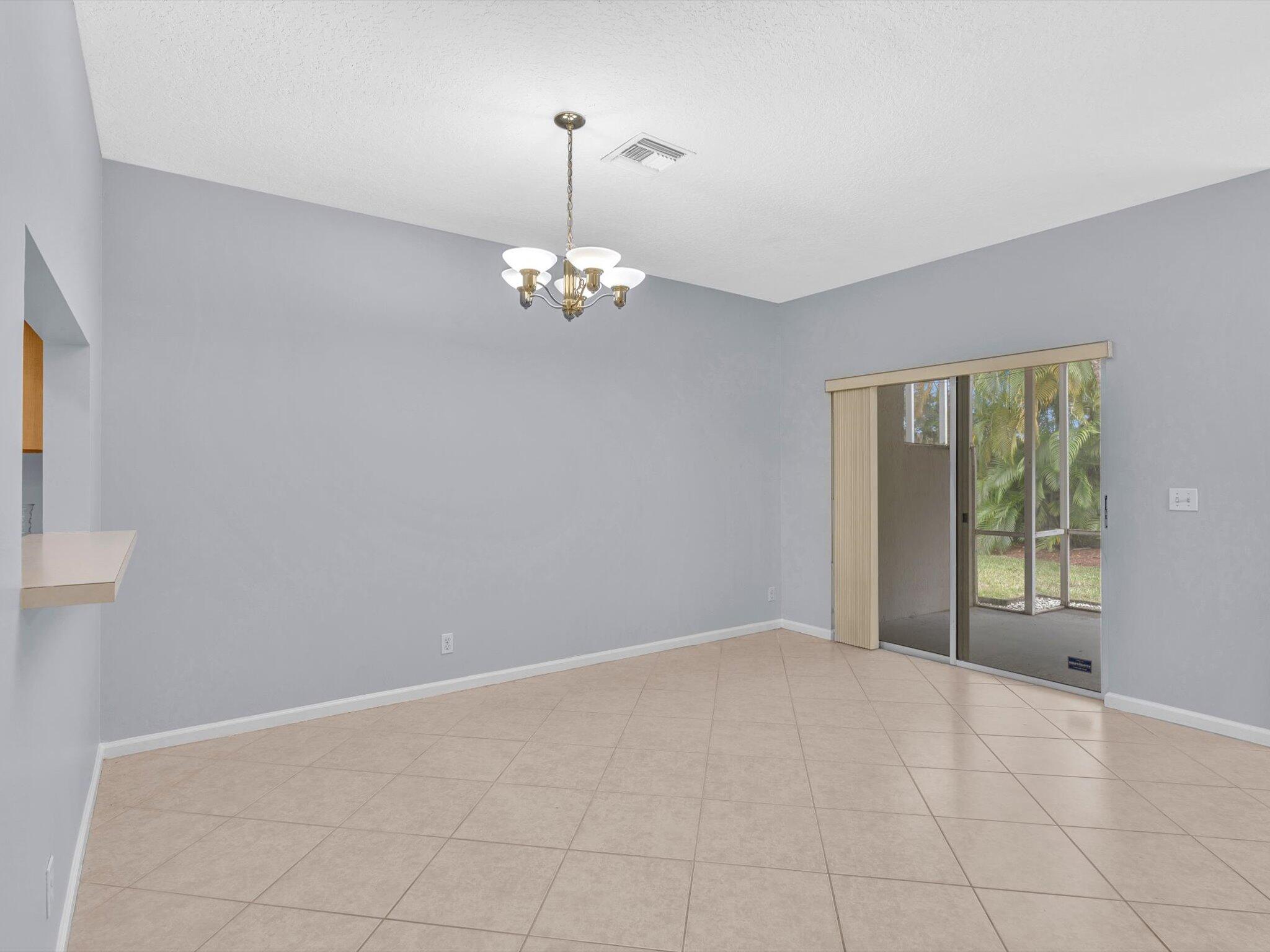 21018 Vía Eden, Unit 21018 Boca Raton, FL 33433 - Photo 7 of 63 a view of an empty room with a window