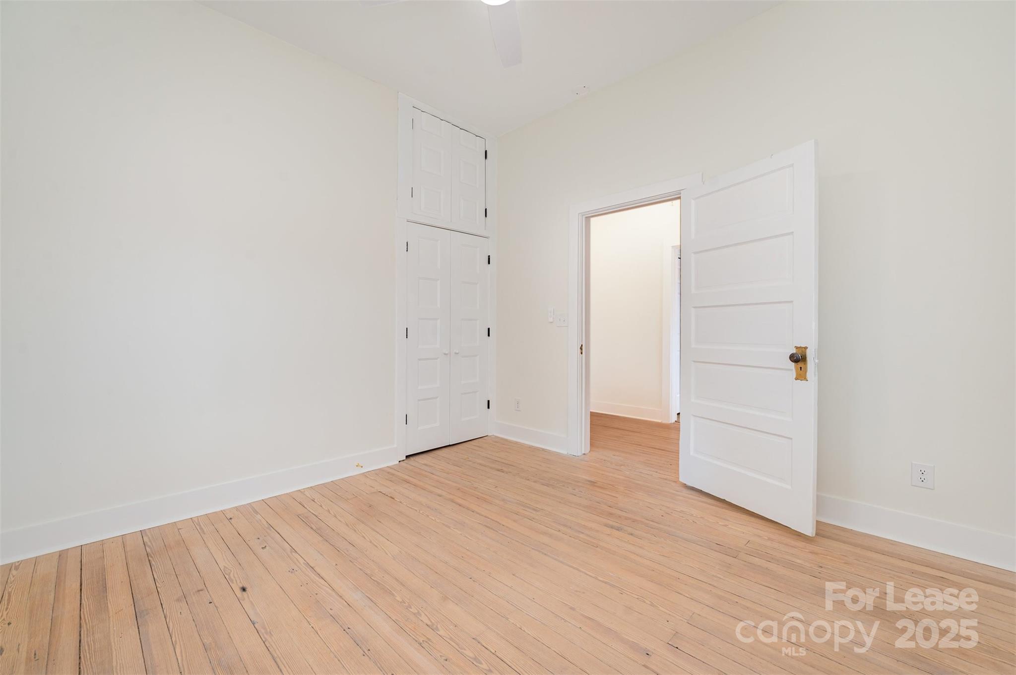 3612 East Brief Road Monroe, NC 28110 - Photo 16 of 22 an empty room with wooden floor
