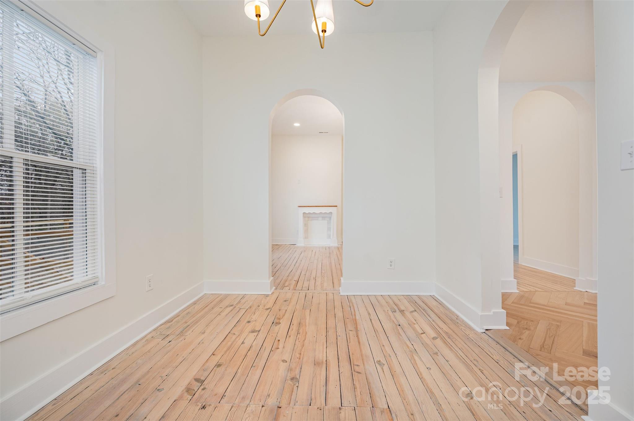 3612 East Brief Road Monroe, NC 28110 - Photo 20 of 22 a view of a room with wooden floor and a window