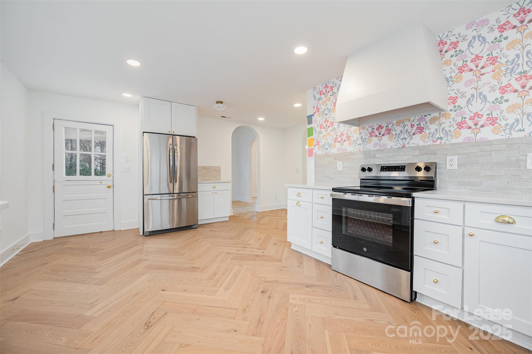 3612 East Brief Road Monroe, NC 28110 - Photo 9 of 22 a kitchen with stainless steel appliances kitchen island granite countertop a refrigerator and a stove top oven