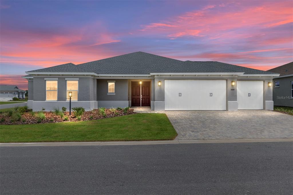 10008 Southwest 85th Pl Road Ocala, FL 34481 - Photo 1 of 1 front view of house with a yard