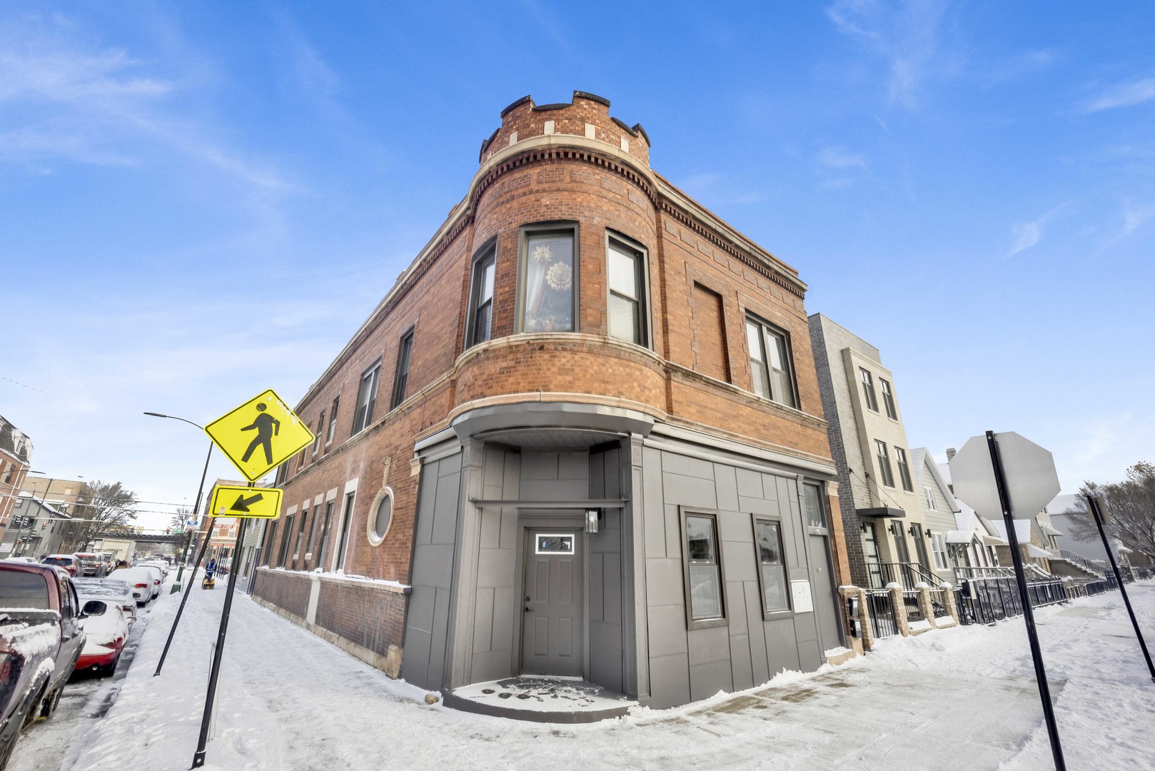 1956 West 21st Place, Unit SF Chicago, IL 60608 - Photo 1 of 12 a front view of a multi story residential apartment building