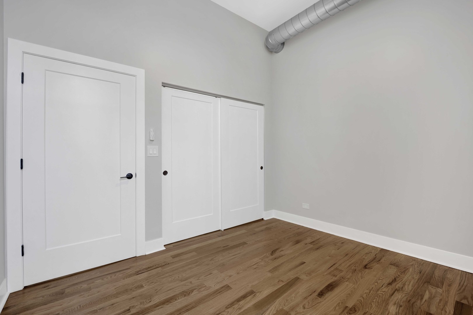 1956 West 21st Place, Unit SF Chicago, IL 60608 - Photo 7 of 12 a view of an empty room with wooden floor