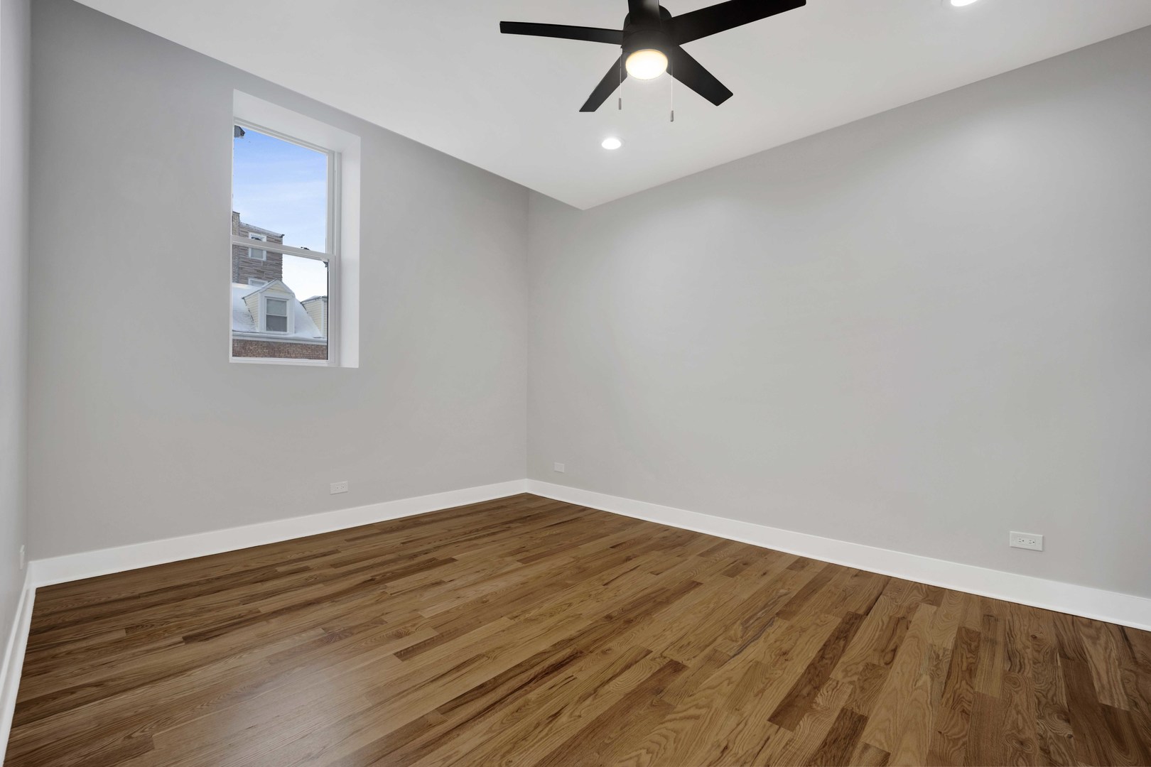 1956 West 21st Place, Unit SF Chicago, IL 60608 - Photo 9 of 12 a view of a room with wooden floor and white walls
