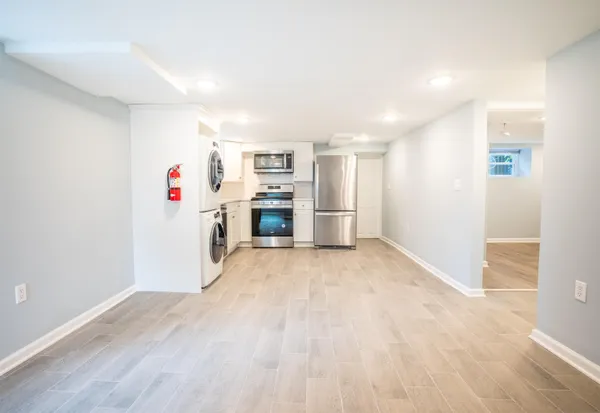 a view of a kitchen with a stove cabinets and a wooden floor