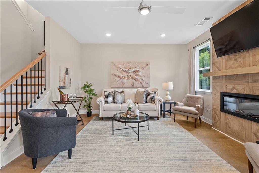 112 Bridgeview (lot 4) Way Canton, GA 30114 - Photo 11 of 45 a living room with furniture a flat screen tv and a fireplace