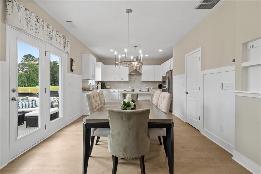 112 Bridgeview (lot 4) Way Canton, GA 30114 - Photo 16 of 45 a view of a dining room with furniture window and wooden floor