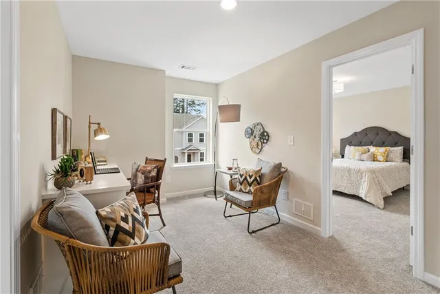 a spacious bedroom with a bed and a chandelier