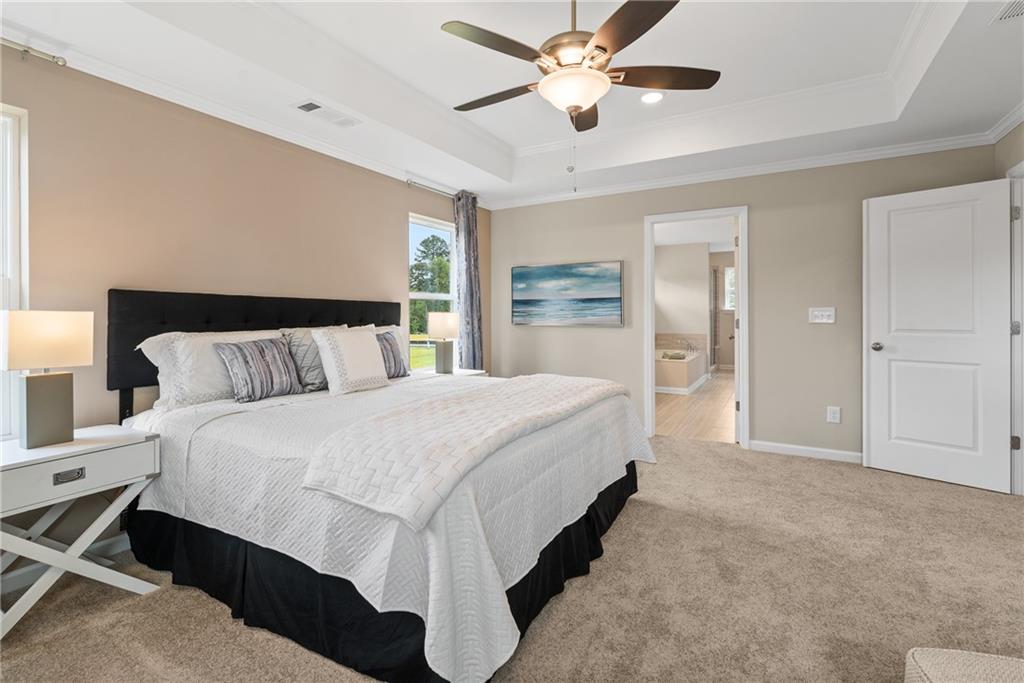 112 Bridgeview (lot 4) Way Canton, GA 30114 - Photo 27 of 45 a spacious bedroom with a bed and a chandelier