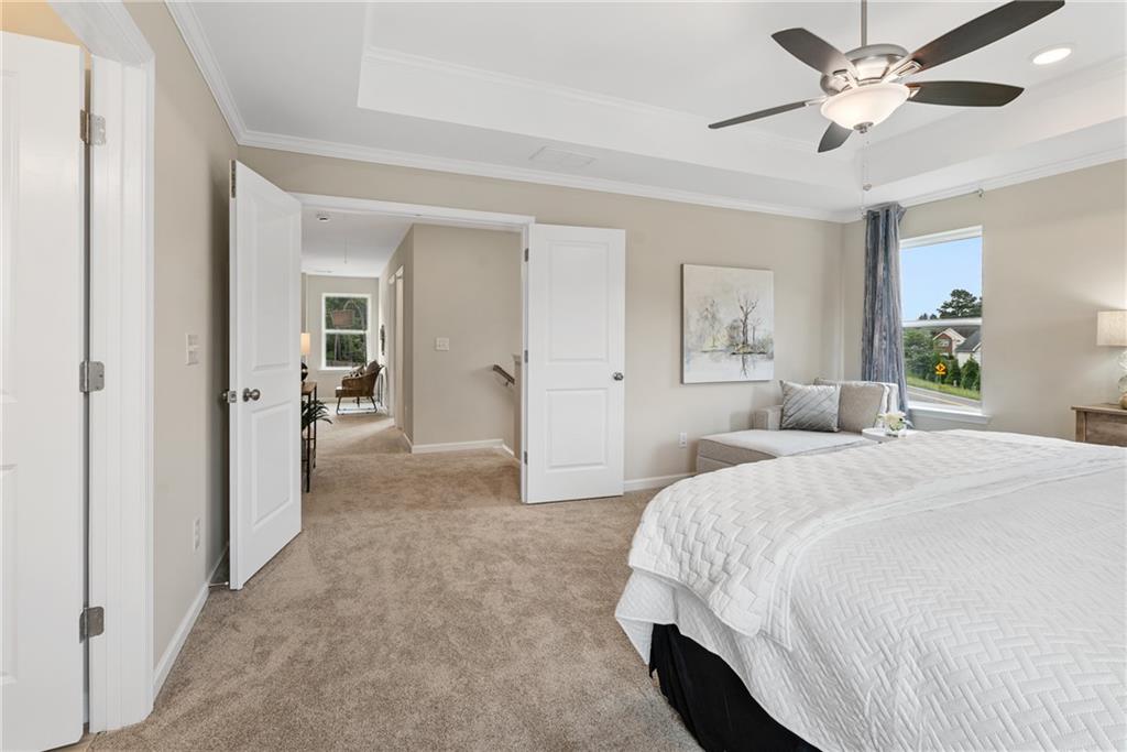 112 Bridgeview (lot 4) Way Canton, GA 30114 - Photo 28 of 45 a spacious bedroom with a bed and ceiling fan