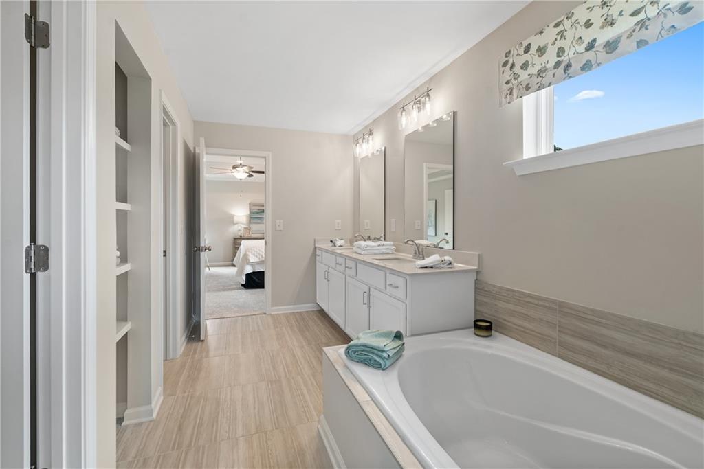 112 Bridgeview (lot 4) Way Canton, GA 30114 - Photo 33 of 45 a bathroom with a sink a mirror and a bathtub