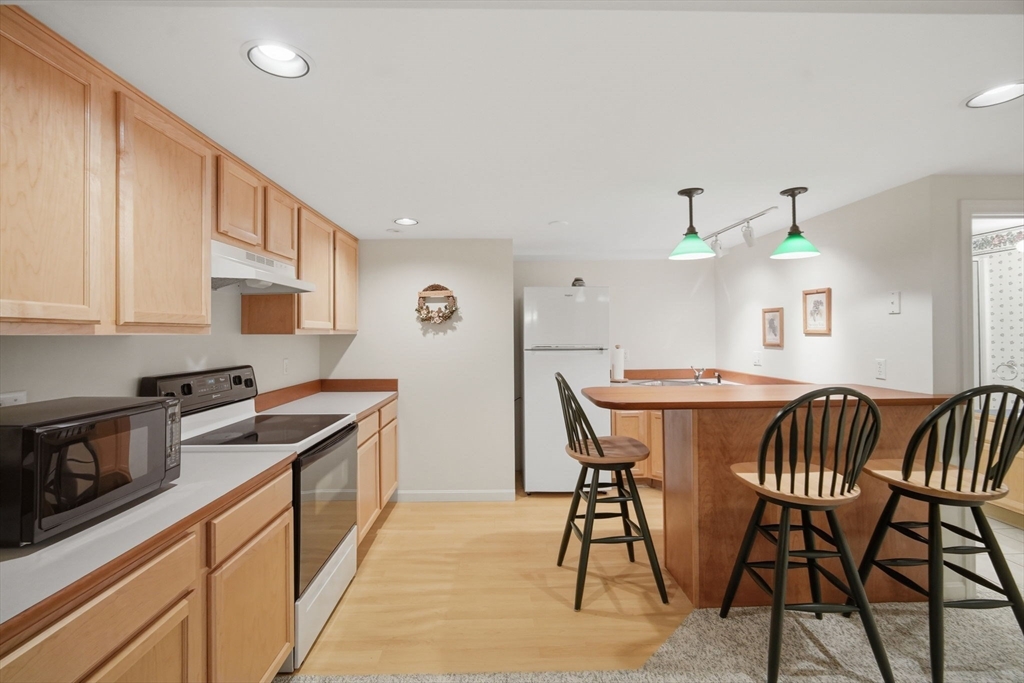 30 Birch Hill Road Northampton, MA 01062 - Photo 32 of 42 a kitchen with stainless steel appliances granite countertop sink stove top oven and cabinets