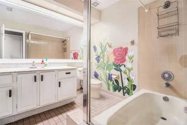 a bathroom with a sink a vanity and a bathtub