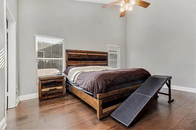 a bedroom with a bed and a chandelier