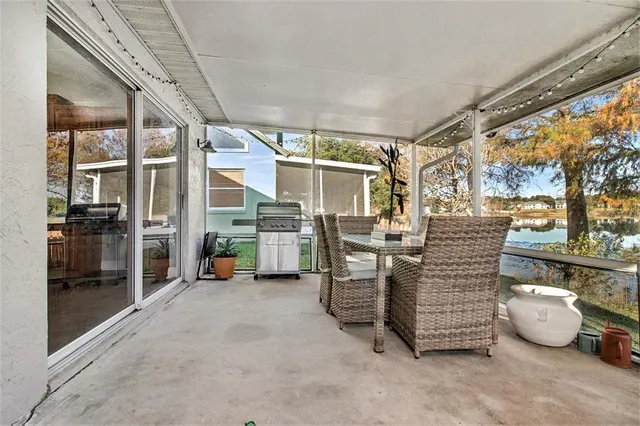 a view of a chairs and table in the balcony