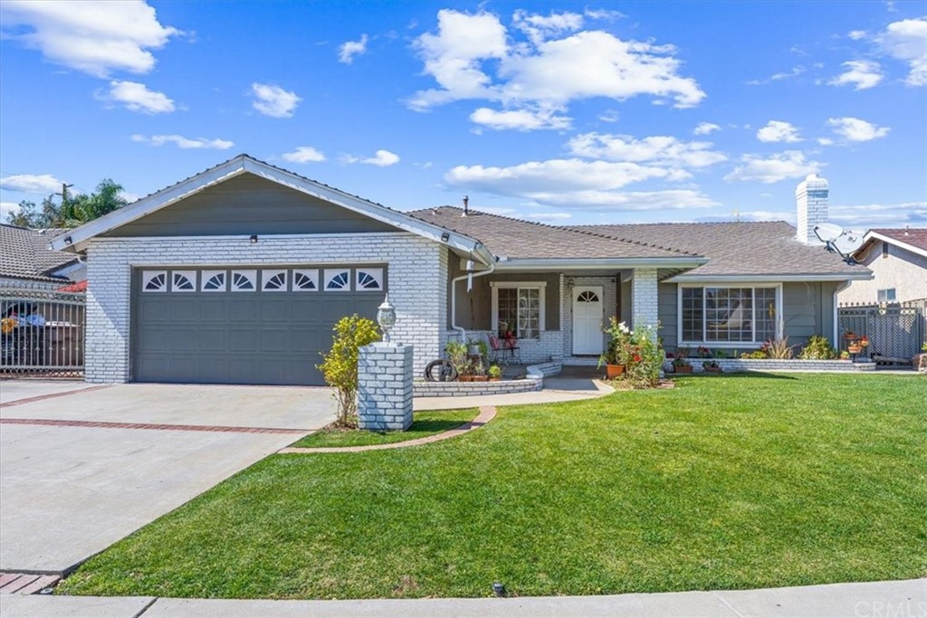 a house view with a sitting space and garden