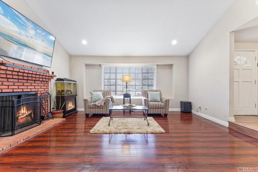 1013 London Circle Placentia, CA 92870 - Photo 11 of 45 a living room with fireplace furniture and a fireplace