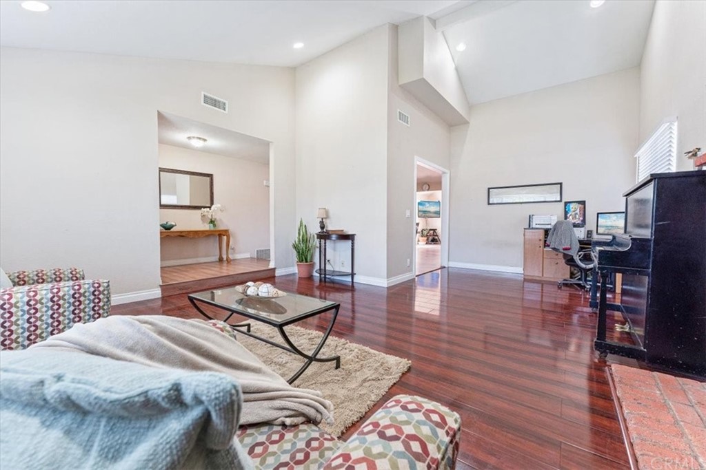 1013 London Circle Placentia, CA 92870 - Photo 13 of 45 a bedroom with a bed and wooden floor