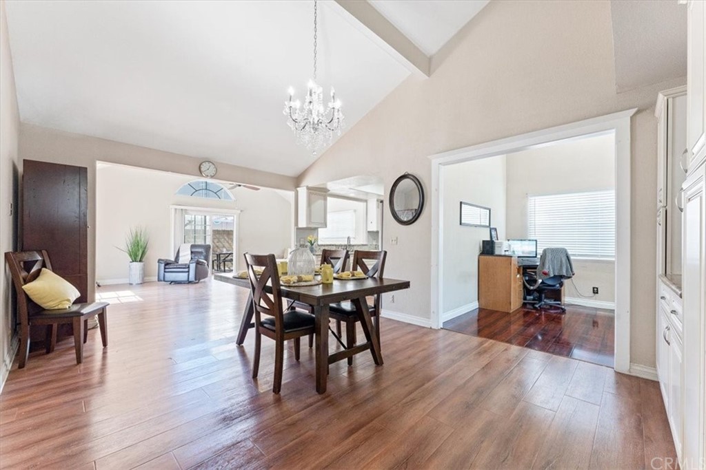 1013 London Circle Placentia, CA 92870 - Photo 15 of 45 a view of a dining room and livingroom with furniture wooden floor a chandelier