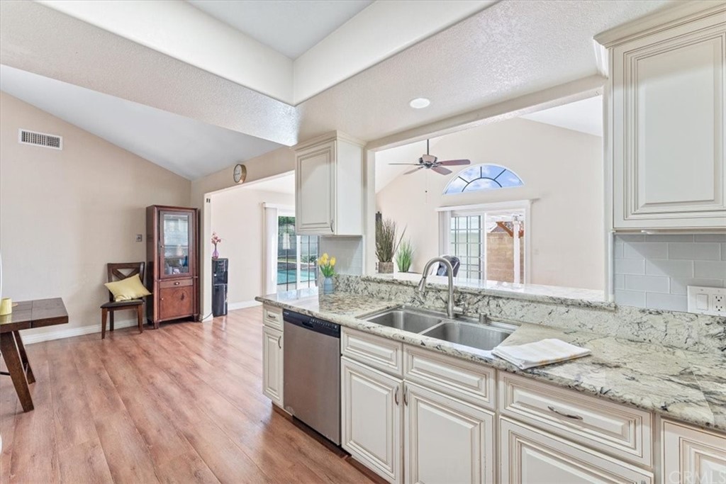 1013 London Circle Placentia, CA 92870 - Photo 22 of 45 a kitchen with a sink cabinets and wooden floor