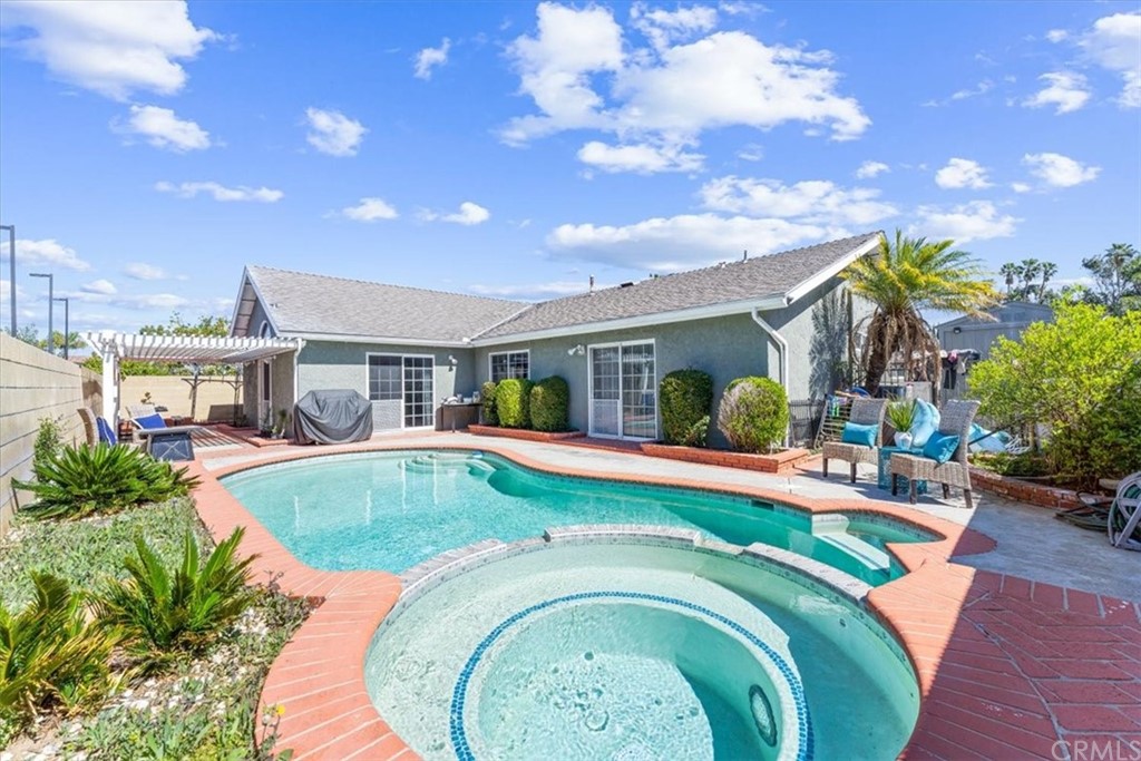 1013 London Circle Placentia, CA 92870 - Photo 36 of 45 a swimming pool with outdoor seating and yard