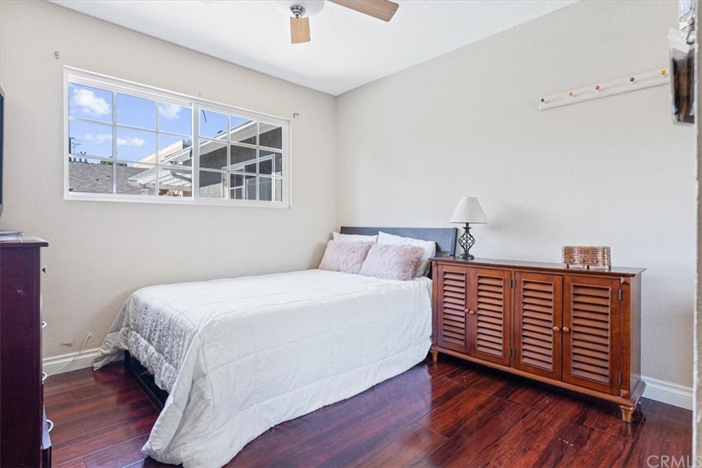 1013 London Circle Placentia, CA 92870 - Photo 40 of 45 a bedroom with a bed and wooden floor