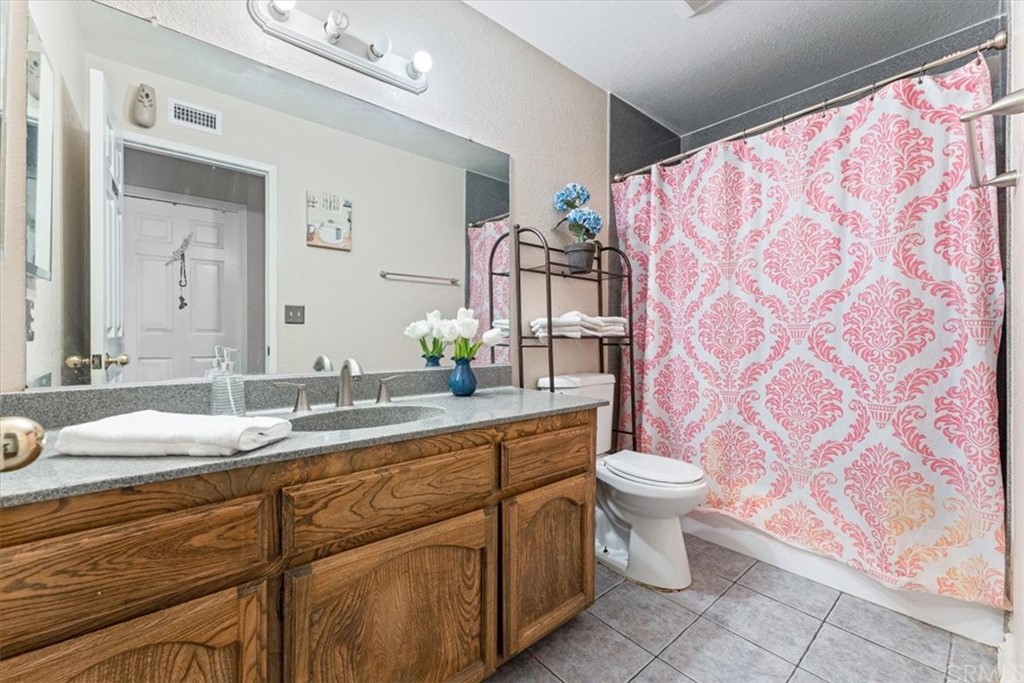 1013 London Circle Placentia, CA 92870 - Photo 42 of 45 a bathroom with a toilet sink and mirror
