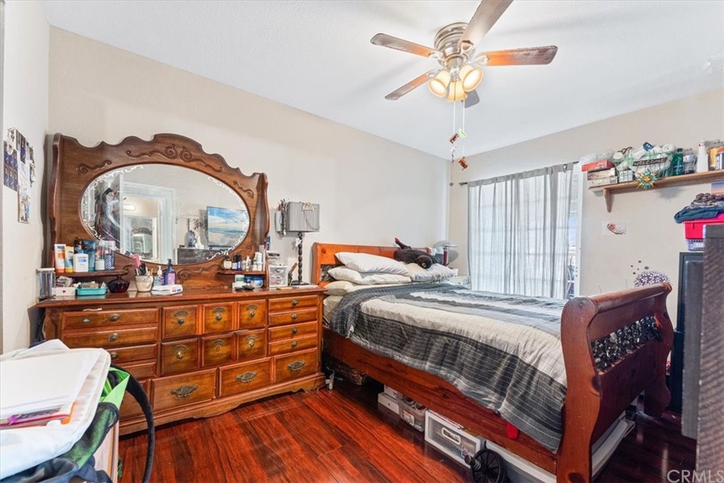 1013 London Circle Placentia, CA 92870 - Photo 45 of 45 a bedroom with a bed and a chandelier