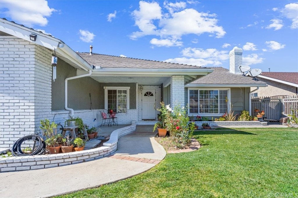 1013 London Circle Placentia, CA 92870 - Photo 5 of 45 a front view of a house with swimming pool and furniture