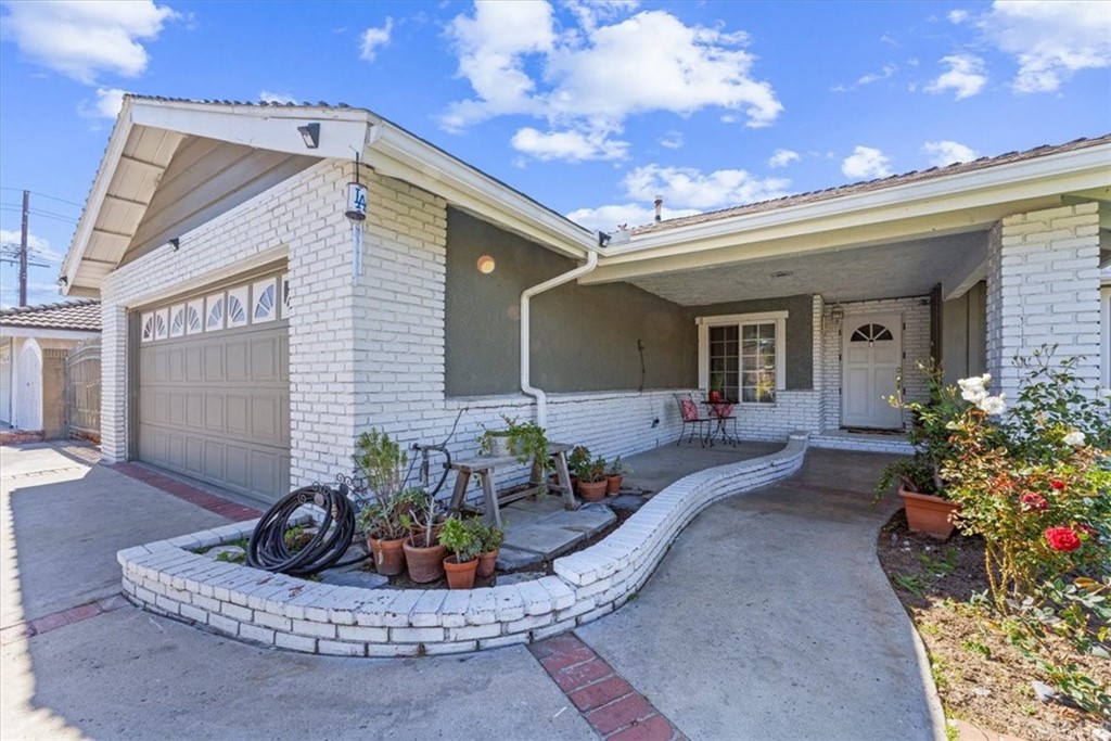 1013 London Circle Placentia, CA 92870 - Photo 6 of 45 a view of a patio with couches table and chairs and potted plants