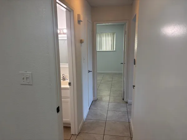 a bathroom with a bath tub with a shower