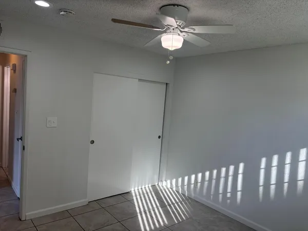 a bathroom with a shower and a sink