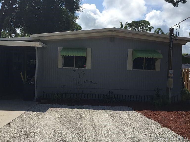 118 Charles Street Edgewater, FL 32141 - Photo 2 of 8 a backyard of a house