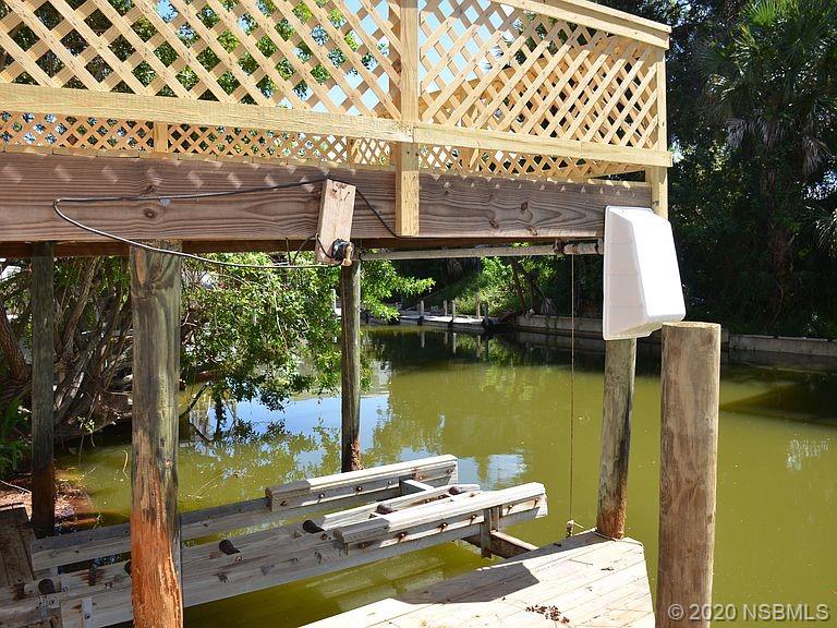 118 Charles Street Edgewater, FL 32141 - Photo 6 of 8 a balcony with a table and chairs