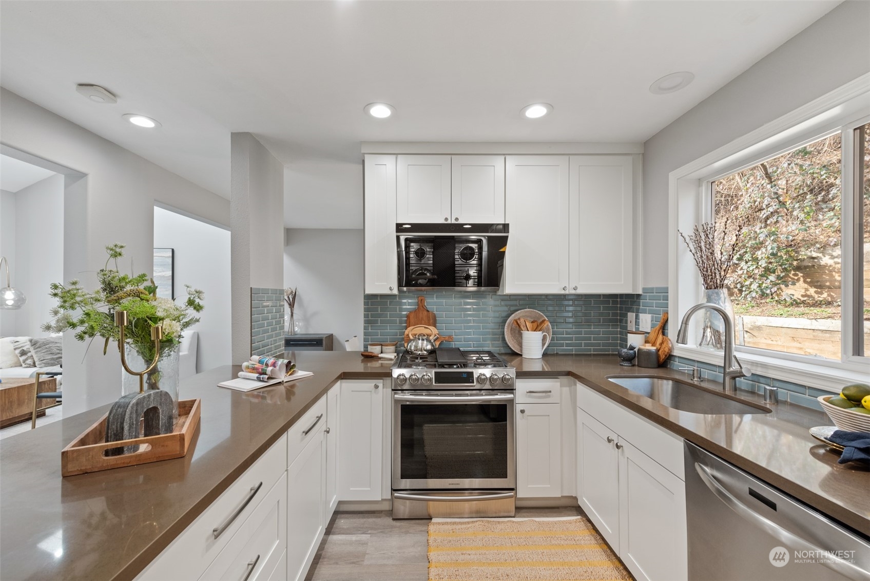 1701 226th Place Southwest Bothell, WA 98021 - Photo 11 of 30 a kitchen with a sink stove top oven and microwave