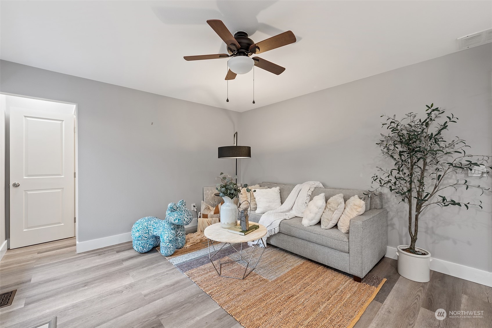 1701 226th Place Southwest Bothell, WA 98021 - Photo 12 of 30 a living room with furniture and a chandelier