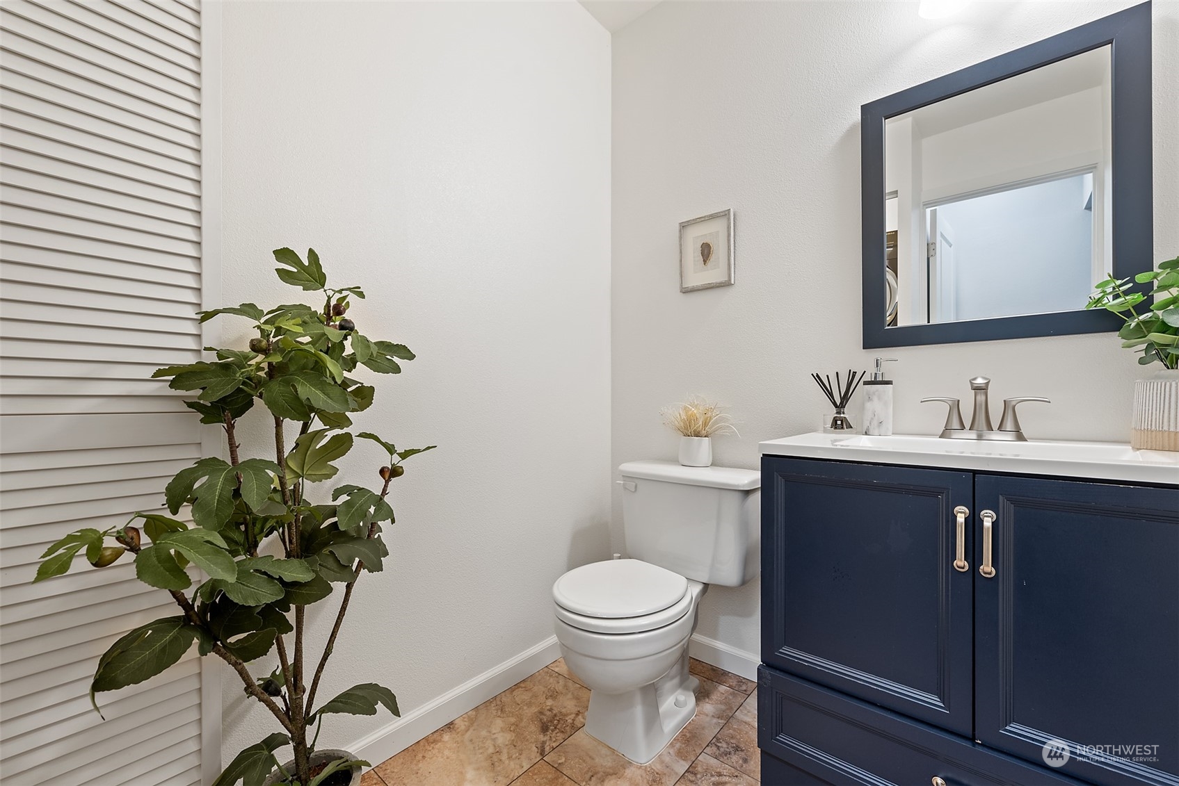 1701 226th Place Southwest Bothell, WA 98021 - Photo 13 of 30 a bathroom with a toilet a sink and a mirror