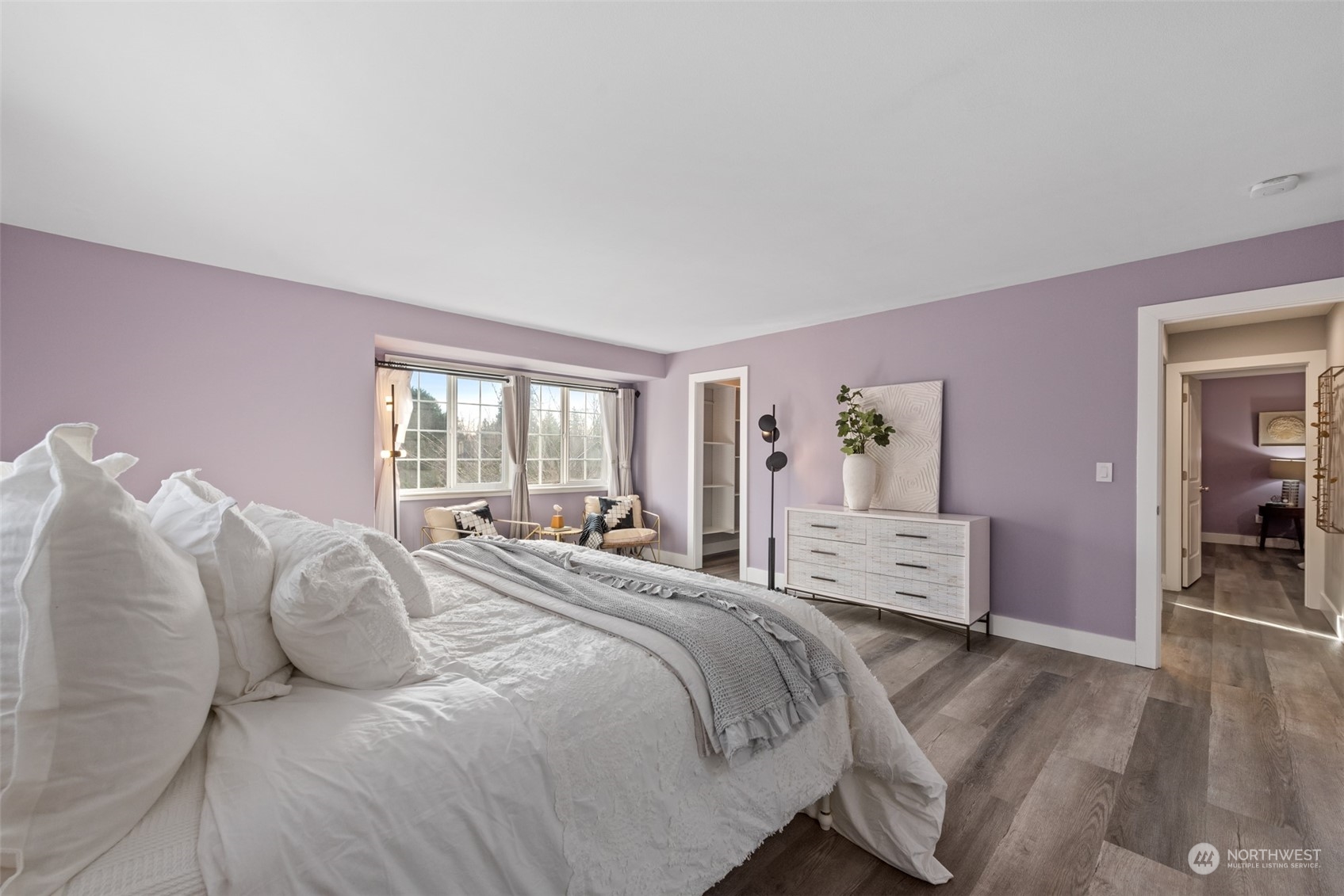 1701 226th Place Southwest Bothell, WA 98021 - Photo 15 of 30 a spacious bedroom with a bed and wooden floor