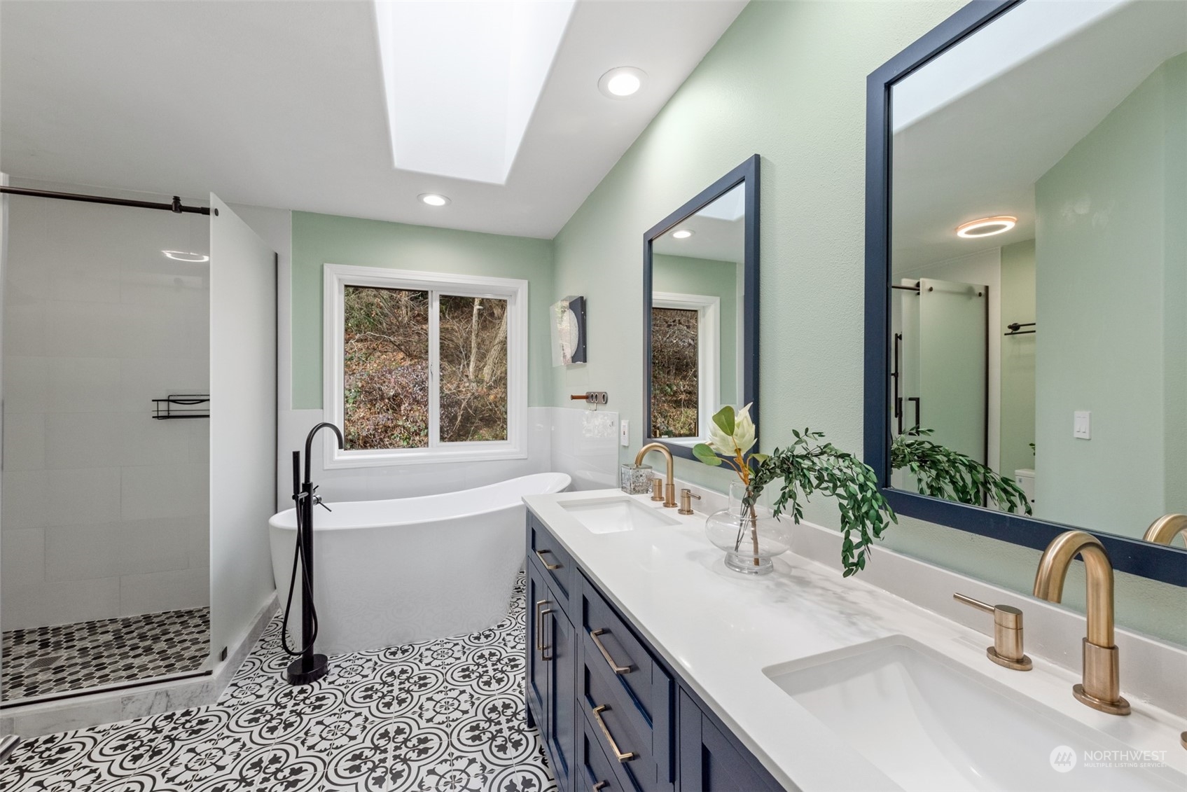 1701 226th Place Southwest Bothell, WA 98021 - Photo 17 of 30 a bathroom with a double vanity sink a mirror and a bathtub