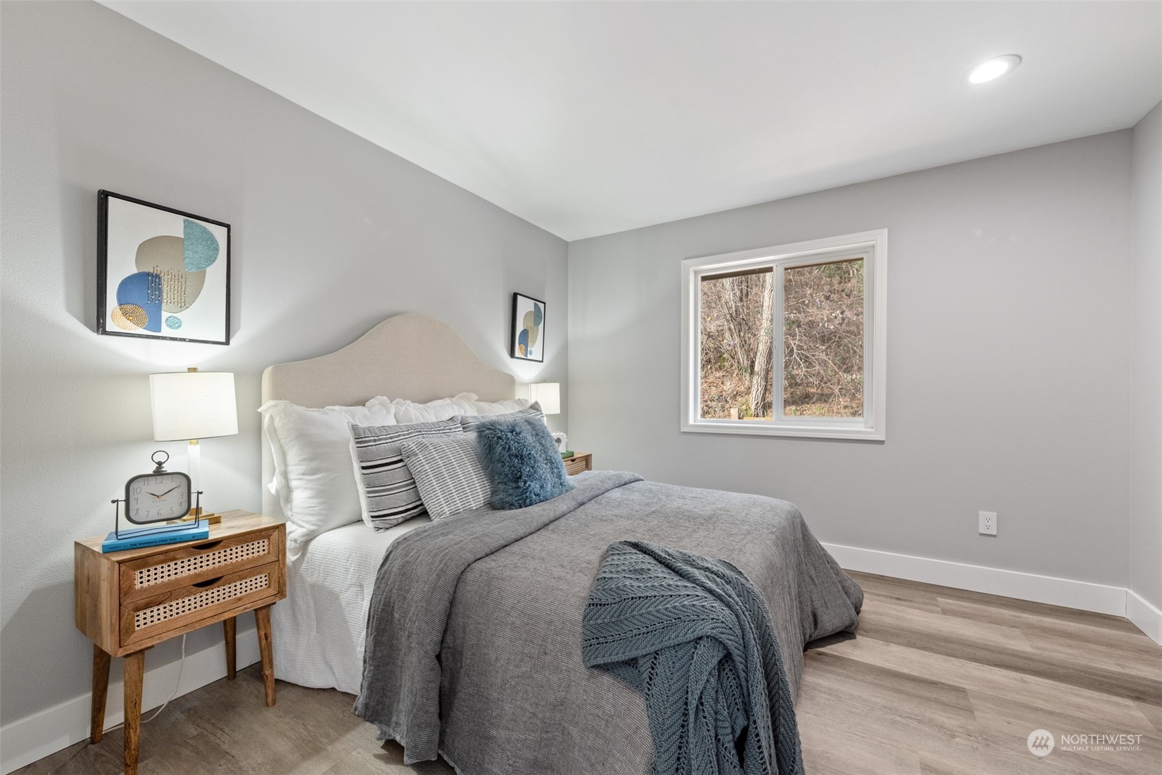 1701 226th Place Southwest Bothell, WA 98021 - Photo 23 of 30 a bedroom with a bed and a lamp on dresser