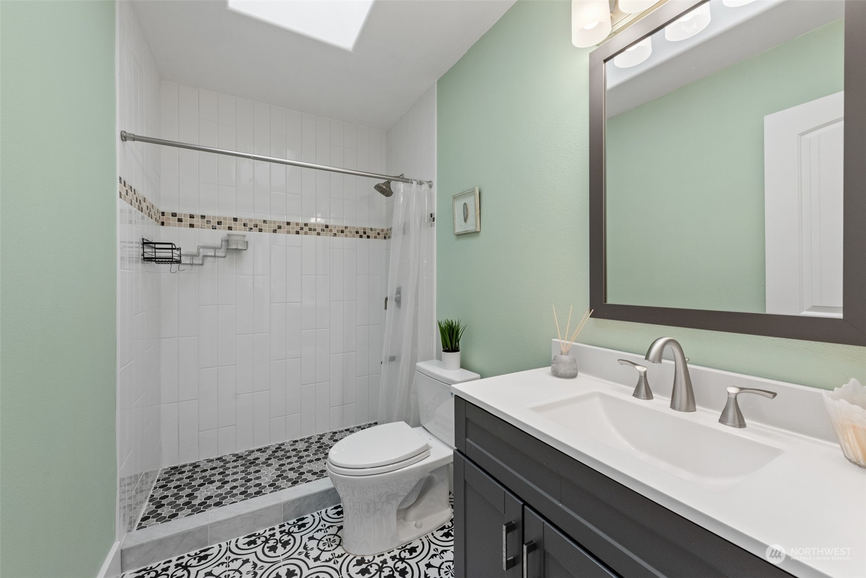 1701 226th Place Southwest Bothell, WA 98021 - Photo 24 of 30 a bathroom with a sink a toilet and shower