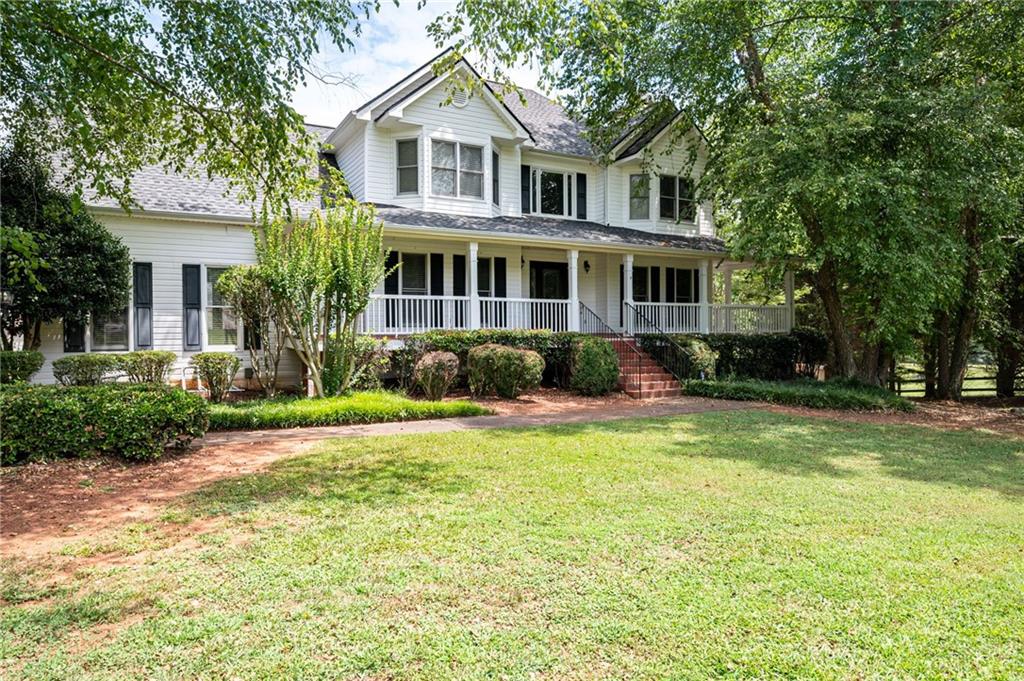 1573 Davis Mill Road North Dallas, GA 30157 - Photo 1 of 1 a front view of a house with a yard and trees
