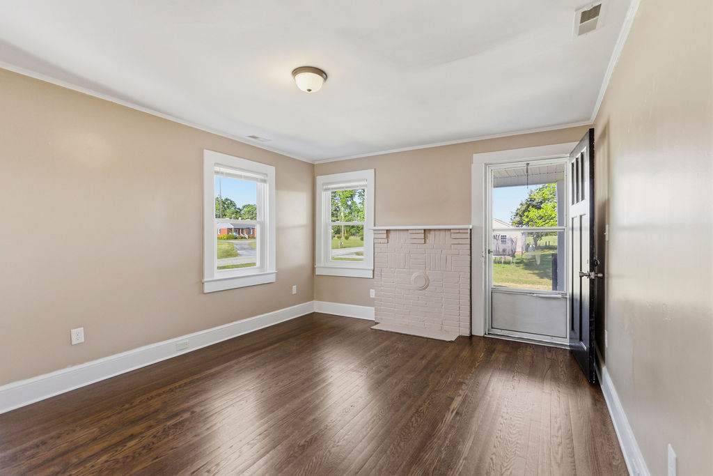 7604 Highway 252 Honea Path, SC 29654 - Photo 8 of 33 This inviting living space features gleaming hardwood floors and a cozy fireplace, perfect for relaxing.