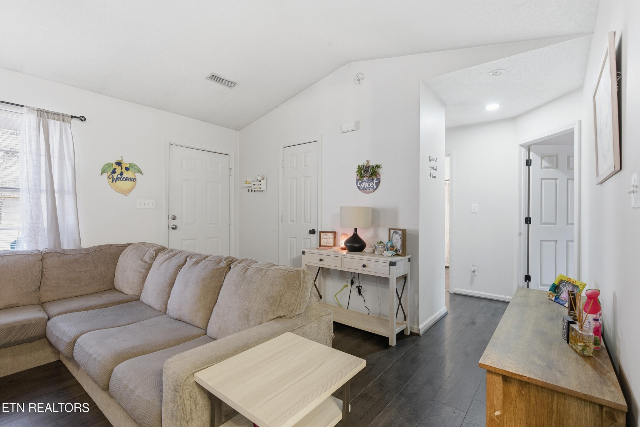 7712 Ralph Youmans Road Corryton, TN 37721 - Photo 16 of 33 a living room with furniture and wooden floor