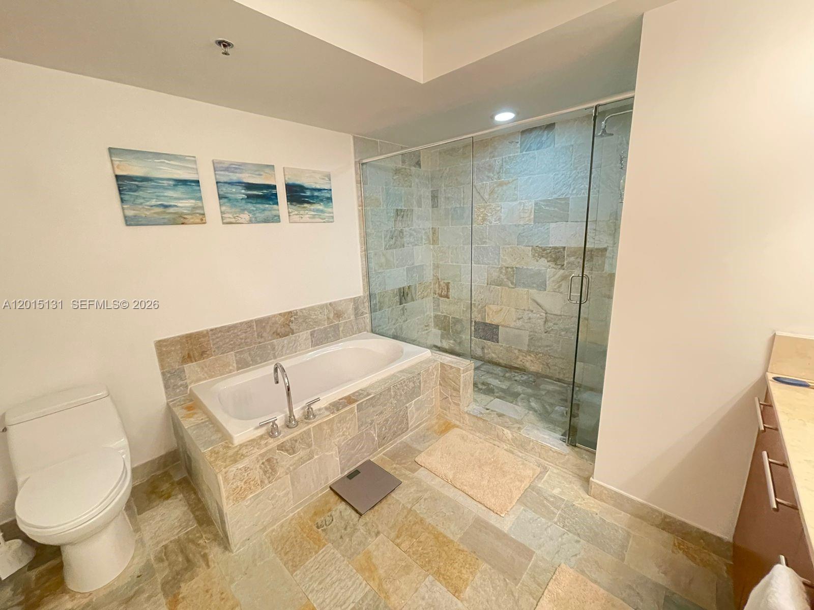 2681 North Flamingo Road, Unit 2004S Sunrise, FL 33323 - Photo 12 of 26 a bathroom with a sink toilet and shower