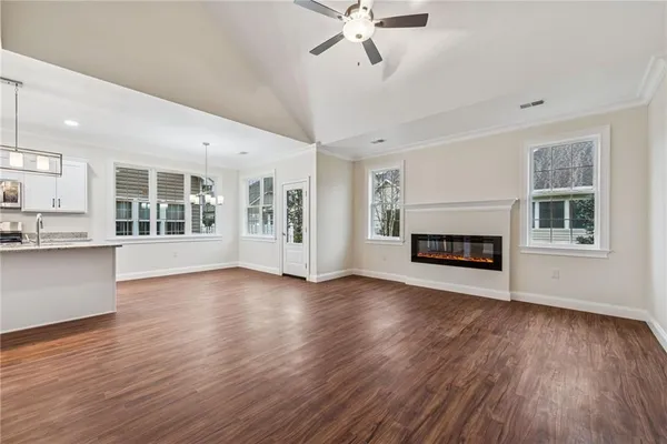 a view of a room with wooden floor