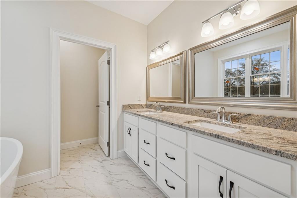 406 Kastner Street Ligonier, PA 15658 - Photo 24 of 35 a bathroom with a granite countertop sink and a mirror