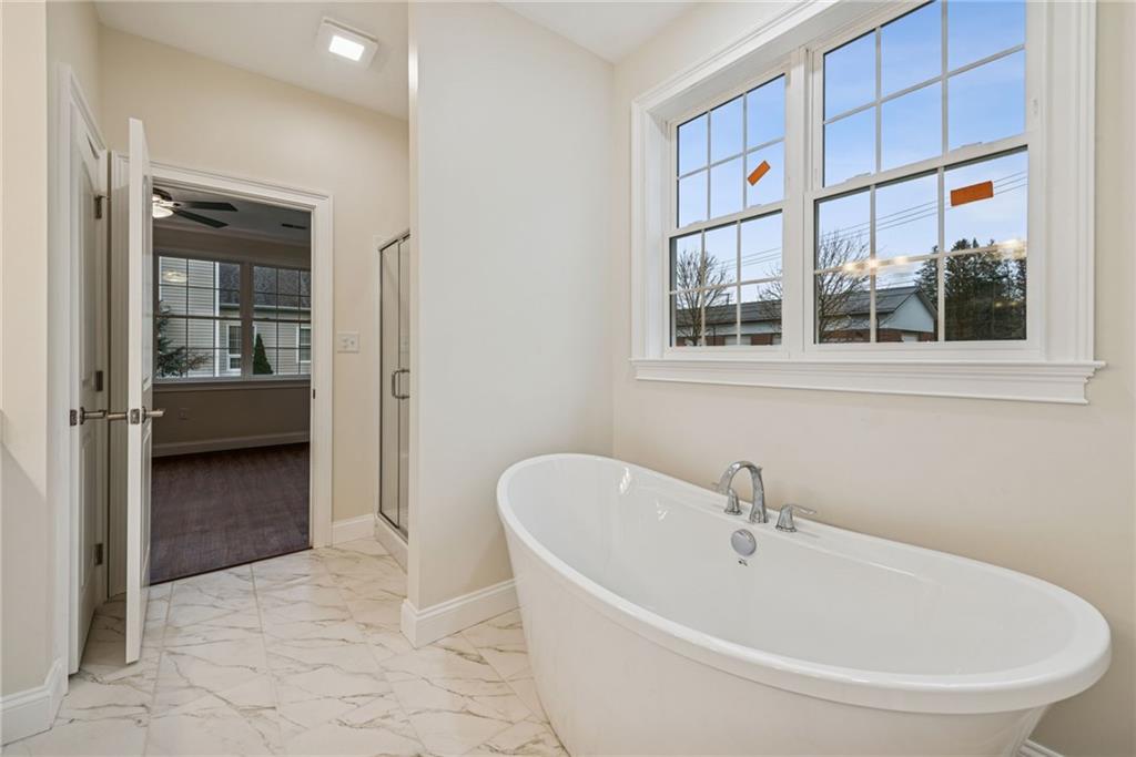 406 Kastner Street Ligonier, PA 15658 - Photo 25 of 35 a bathroom with a bathtub and a shower