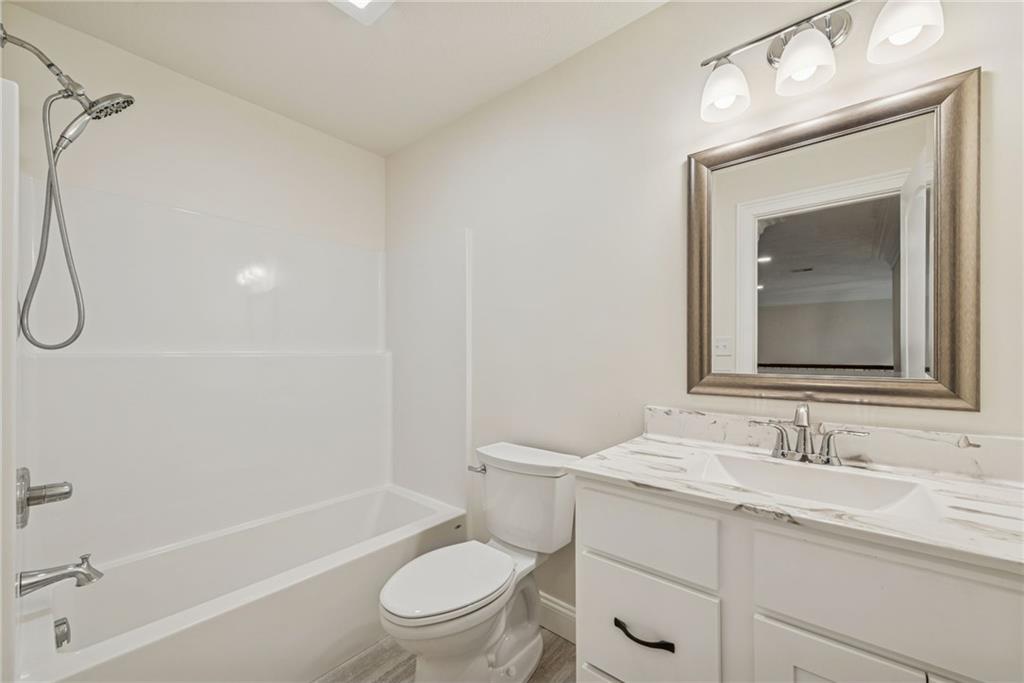 406 Kastner Street Ligonier, PA 15658 - Photo 33 of 35 a bathroom with a toilet sink vanity granite and shower